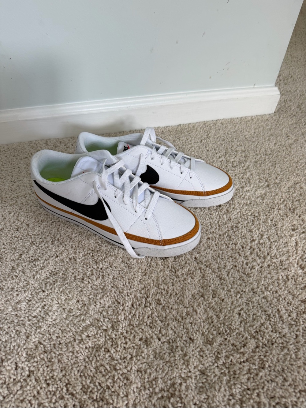 Nike’s Court Legacy Sneakers with Black Swoosh and Brown Accent
